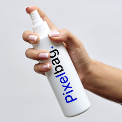 Hand Holding White Plastic Spray Bottle Mockup