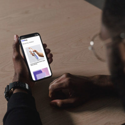 Man Holding iPhone XR Mockup